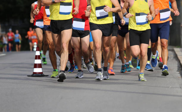istock runners on the road during the Marathon race 1180493819