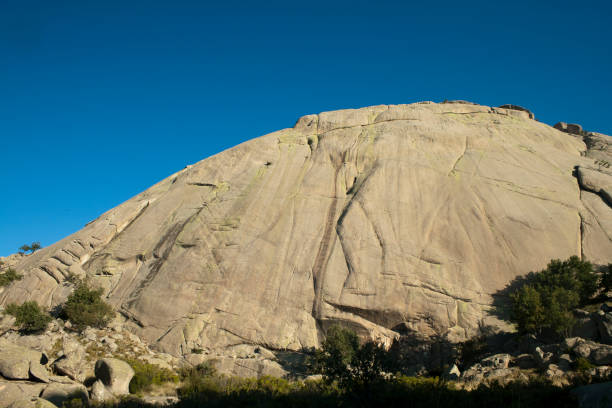 istock Monolithic granite mountain. The Helm in La Pedriza. 1180495786