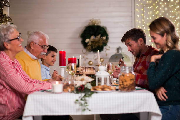 istock Family gathered for the Christmas dinner 1180497151