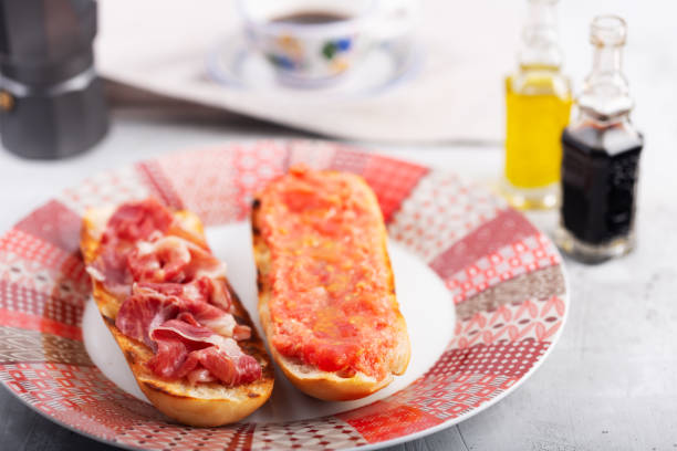 istock Spanish tomato and ham toast, traditional breakfast or lunch 1180498711