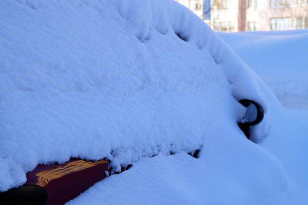 istock The car is covered in snow after heavy snowfall. 1180505986