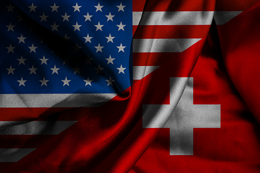 Waving flag of Switzerland and USA