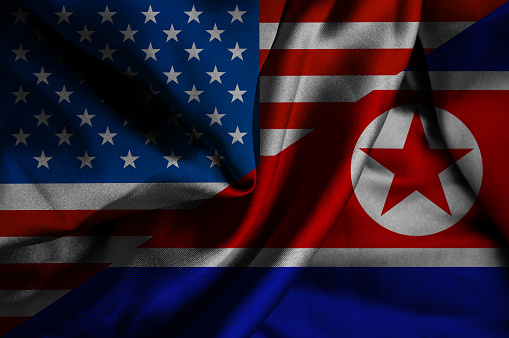 Waving flag of North Korea and USA