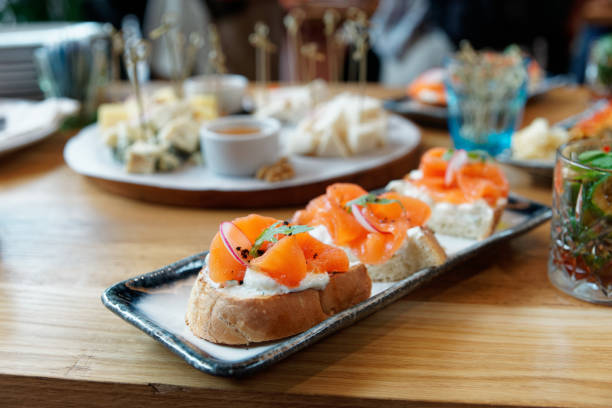istock Smoked salmon slices and creamy cheese on bread 1180509595
