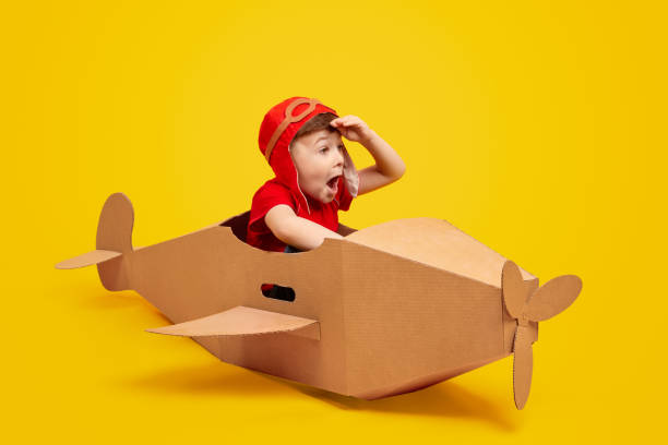 istock Astonished little pilot looking at distance 1180509704