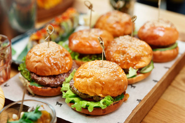 istock Hamburgers on wooden board 1180509719
