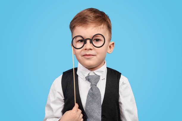 istock Little boy with glasses on stick 1180509761