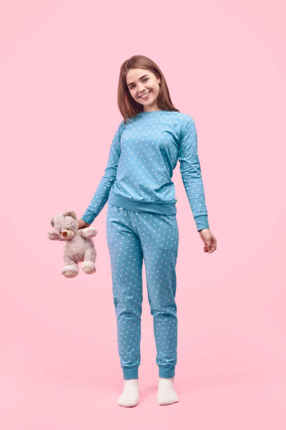istock Smiling teenager with teddy bear 1180509786