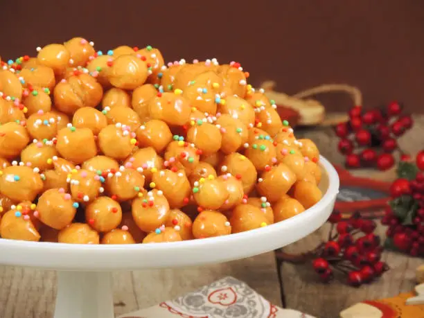 Struffoli: balls of dough with honey. Traditional Christmas cake from Naples, Italy