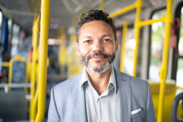Portrait of man looking at camera on a bus