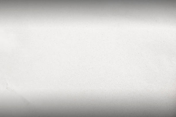 istock Old texture paper white cardboard sheet of empty paper white background. 1180515936