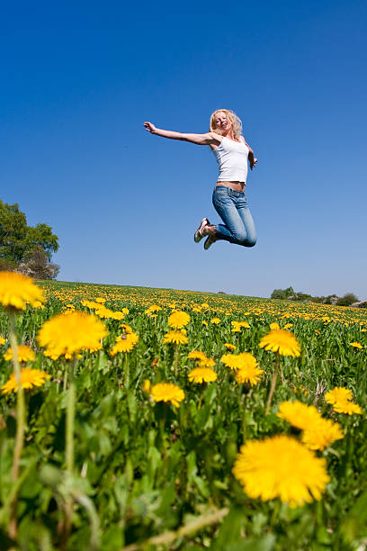 istock happy young woman on meadow 118052164