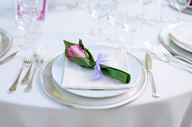 istock Beautiful table setting with crockery and flowers for a party, wedding reception or other festive event 1180522976