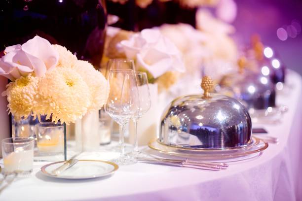 istock Beautiful table setting with crockery and flowers for a party, wedding reception or other festive event 1180522992