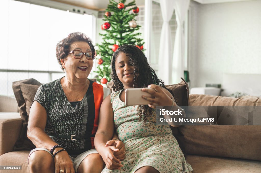 Family enjoying Christmas at home Domestic Life, Domestic Room, Enjoyment, Excitement, Christmas Christmas Stock Photo