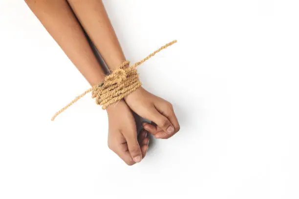 Photo of Hands tied by strong rope