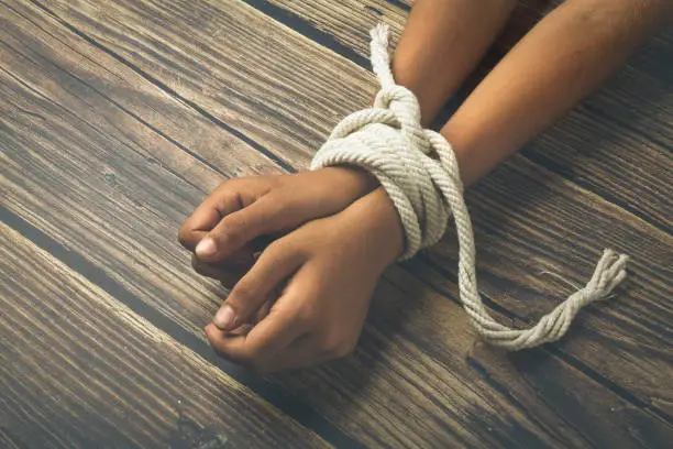 Hands tied by strong rope