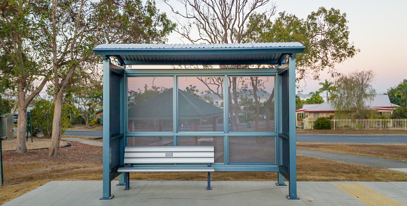 A bus stop shelter in front of a barbecue area in an Australian country town