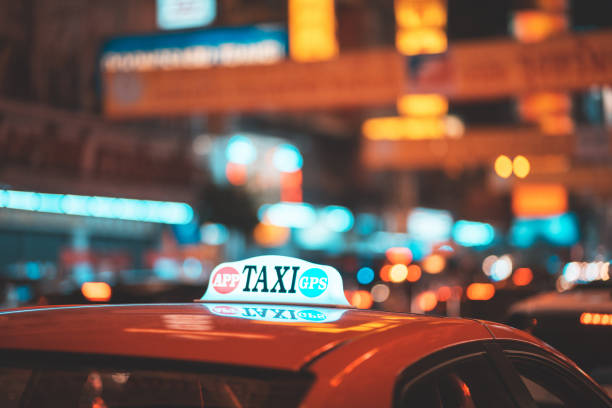 istock Taxi car on the street at night. 1180534607