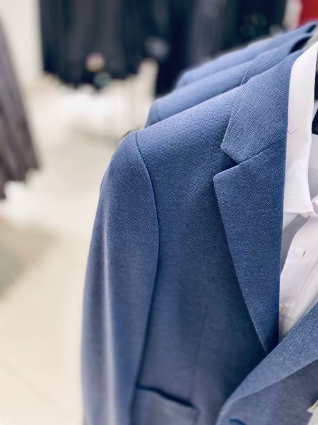 istock Men’s Suits in Clothing Store 1180535497