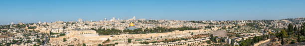 Wide Angle Panorama of the Old City of Jerusalem with Bright Blue Sky Wide Angle Panorama of the Old City of Jerusalem with Bright Blue Sky pool of siloam stock pictures, royalty-free photos & images