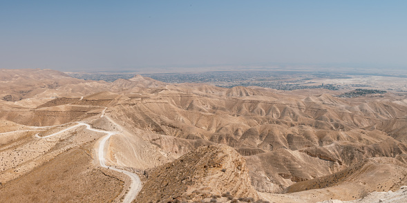 View of the Jordan Valley Desert Mountains and the City of Jericho next to the Dead Sea