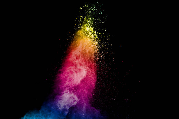 istock Colorful powder explosion on black background. Abstract pastel color dust particles splash. 1180542163