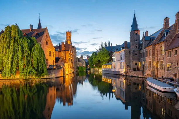 Bruges skyline with old buildings at twilight in Bruges, Belgium.