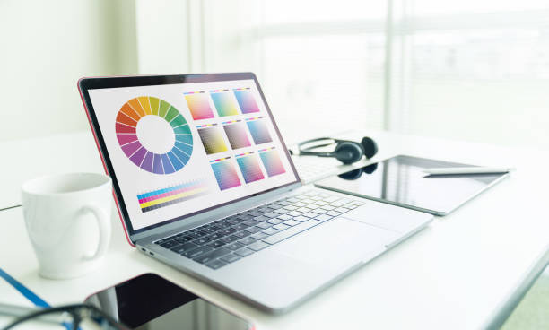 istock Graphic design concept. Laptop computer in office. Color management. 1180547378