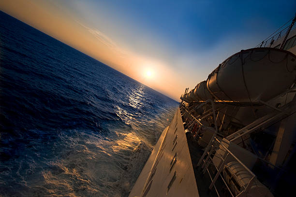 Arabian Sea near Djibouti: The sun sets and rays shoot through the clouds.