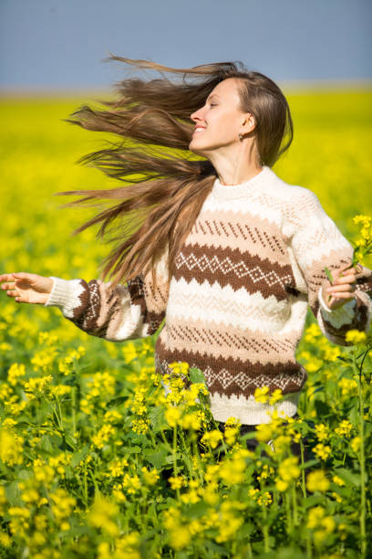 istock Happy young woman in autumn or spring field 1180548255