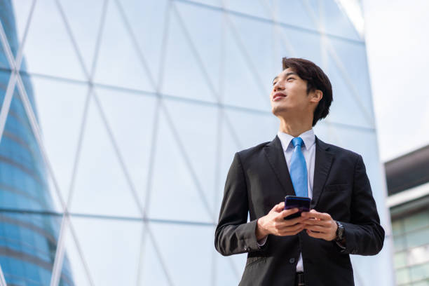 istock Asian businessman in modern city 1180548338