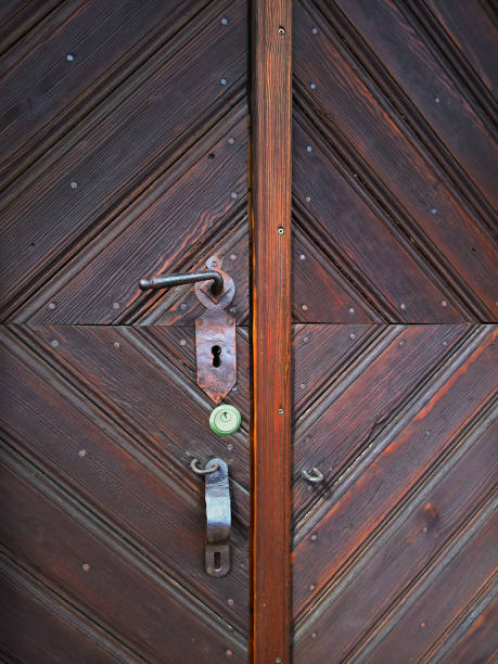 Old metal door with handle and lock