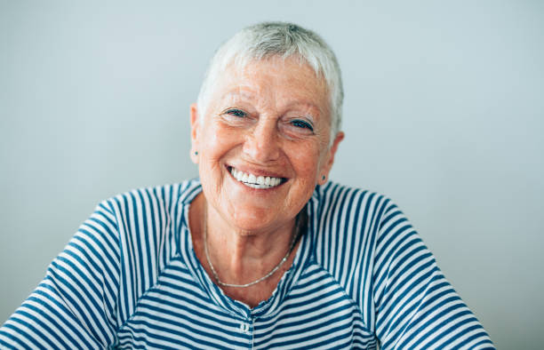 istock Confident and happy senior woman 1180551834