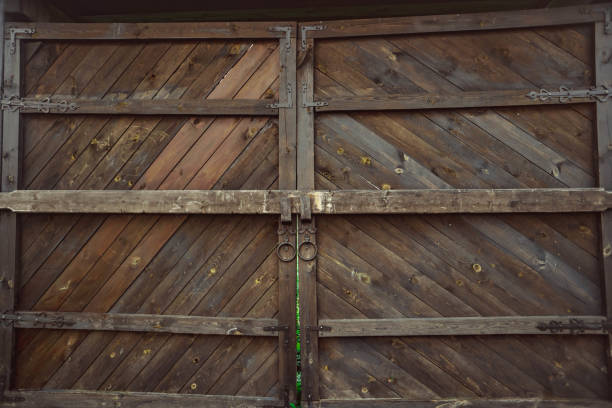 istock old wooden gate with a bolt 1180554206