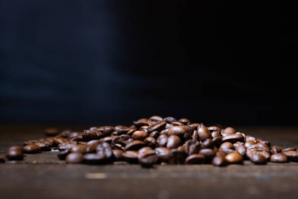 istock Coffee beans on a wooden table 1180555450