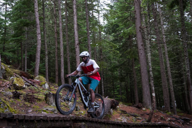 istock Mountain bike rider rides down the technical trails 1180555474