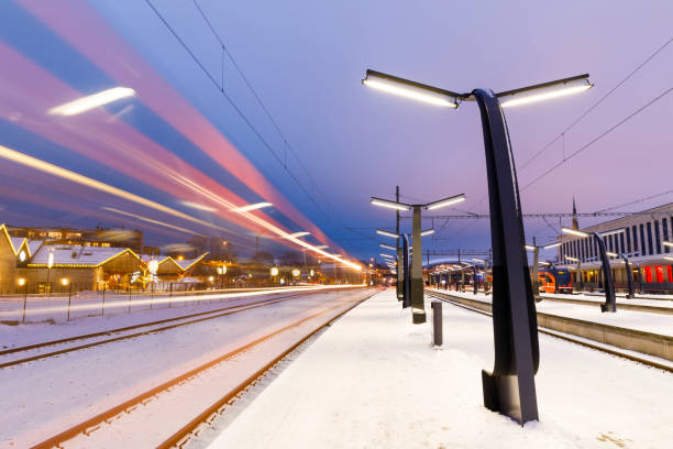 istock Train platform and lights of passing train 1180555494
