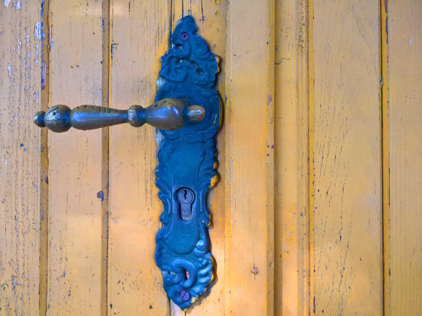 istock Old metal door with handle and lock 1180555661