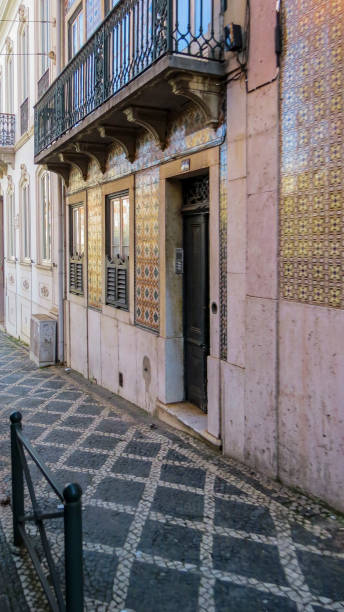 istock Typical street  with  buildings with tiles (azuleios)  wall 1180556608