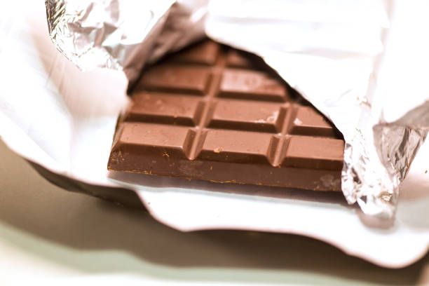 istock chocolate black pieces pile with almonds isolated 1180559457
