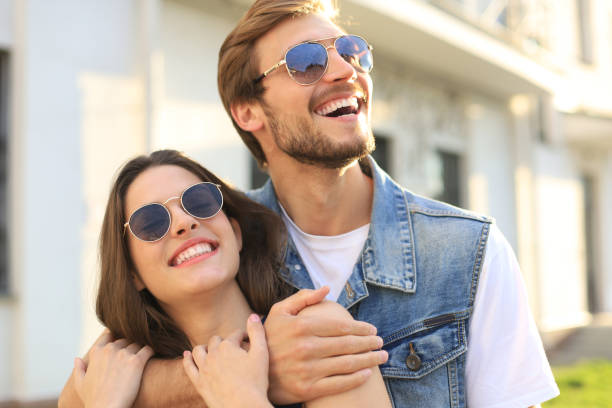 istock Handsome young man embracing his beautiful girlfriend while spending time together in the city. 1180563014