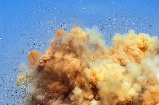 Debris and dust clouds after the detonator blasting