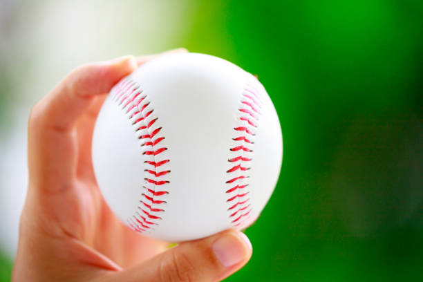 istock Green background and baseball ball 1180565038