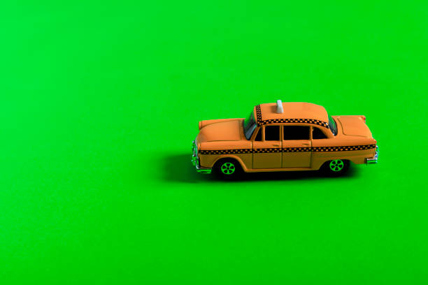 istock Green background and taxi 1180565086