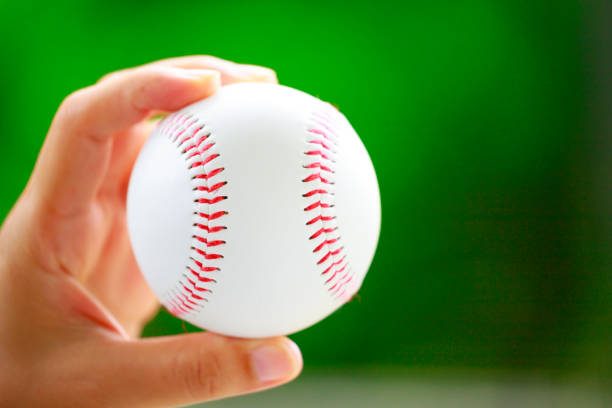 istock Green background and baseball ball 1180565087