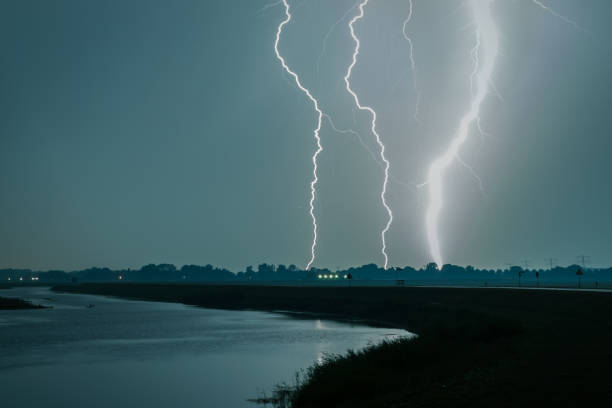 istock Extremely bright lightning bolt near a river in the Netherlands 1180566893