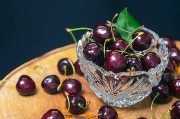 istock sweet cherry in a crystal vase. 1180568061