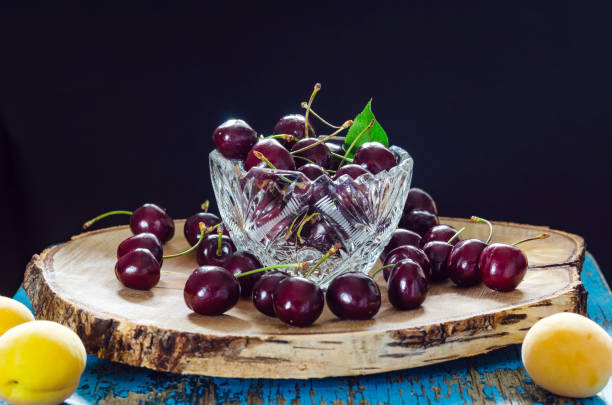 istock sweet cherry in a crystal vase. 1180568161