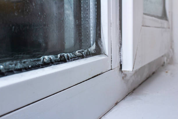istock the problem of freezing of plastic Windows in the winter time, the front and background blurred with the bokeh effect 1180573236